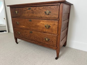 A Victorian Quarter Sawn Oak Three Drawer Chest On Casters