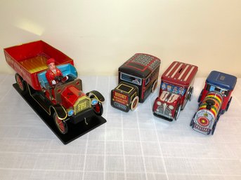 A Collection Of Tin Advertising Vehicles
