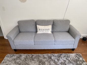 Three Cushion Sofa With Attached Back Pillows And Cushions
