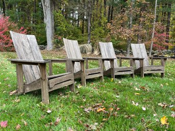 A Group Of 4 Wooden Adirondack Chairs