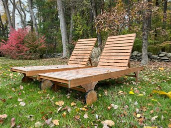 A Pair Of Safavieh Wood Sun Loungers With Wheels