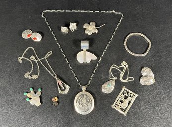 An Assortment Of Jewelry In Sterling Silver: Pendants, Pins & Earrings, With Three Pieces In Pewter