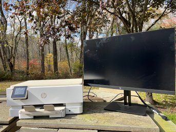 An  HP Z27 LCD Monitor And HP Envy Inspire Printer