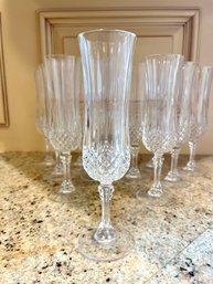A Set Of 12 Cristal D' Arques Longchamp Champagne Flutes