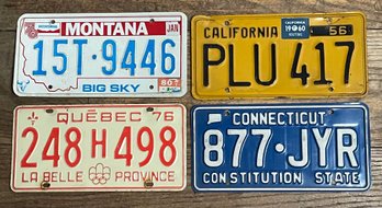 Four Vintage License Plates