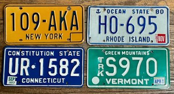 Four Vintage License Plates
