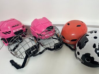 A Collection Of Children's Helmets - 2  Hockey XS  -  2 Bike Helmets