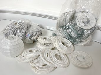A Collection Of Mini White Paper Lanterns With Lights