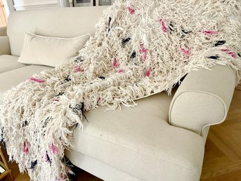 A Shaggy White Throw With Pink And Blue Accents - Cotton