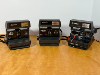 Three Polaroid One Step Flash Foldable Cameras