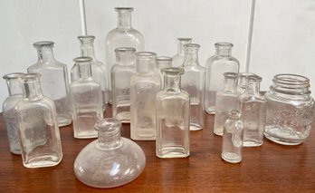 Group Of 19 Varied Vintage Clear Glass Bottles