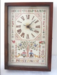 A Vintage Needlepoint Sampler Battery Operated Wall Clock