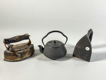 2 SAD IRONS AND A CAST IRON KETTLE