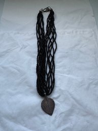Black Multi-strand Beaded Necklace Featuring A Leaf-shaped Pendant Sterling Silver