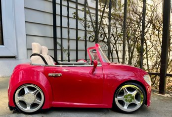An American Girl Red Remote Control Convertible Car
