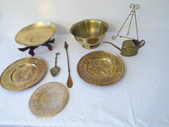 A Table Full Of Decorative Brass