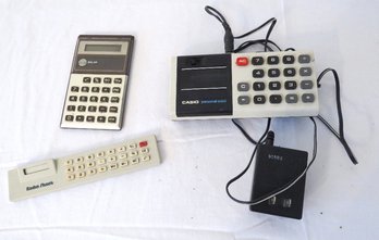 A Trio Of Three Vintage Calculators Including Casio, Sears And Radio Shack