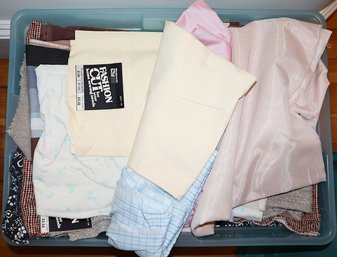 Plastic Bin Full Of Assorted Fabrics