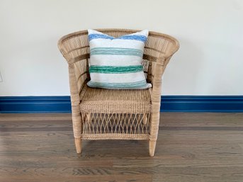Stylish Woven Arm Chair With Decorative Striped Throw Pillow