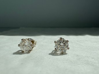 Pair Of Sterling Silver Earrings With Clear Stones, Likely Cubic Zirconias