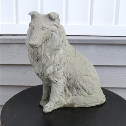 A Concrete Garden Sculpture Of A Collie