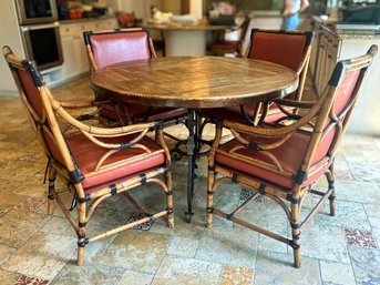 Round Reclaimed Wood Dining Table With Wrought Iron Base And Four Split Reed Chairs