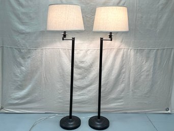 A Pair Of Burnished Metal Floor Lamps