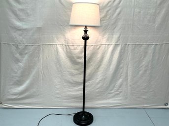 A Burnished Metal Floor Lamp