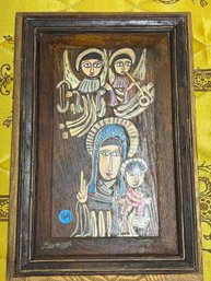 A CARVED AND PAINTED WOOD PANEL