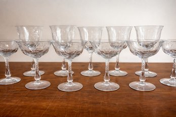 Elegant Set Of Crystal Coupes And Wine Glasses With Etched Pattern And Twisted Stem
