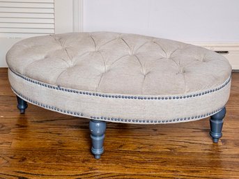 Plush Grey Button Tufted Ottoman With Wood Turned Legs And Nailhead Trim