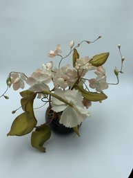 Faux Magnolia Flowers In Black Vase