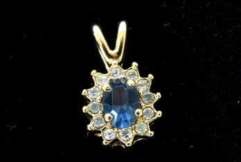 Elegant 10K Yellow Gold Oval Pendant With Blue And Clear Stones