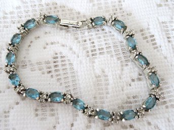 Vintage Signed AVON Light Blue Rhinestone Tennis Bracelet Silver Tone