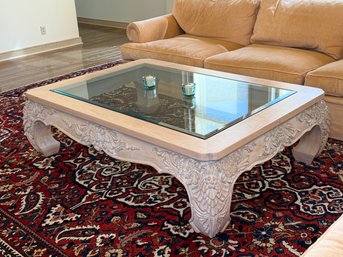 A Stunning Wood Carved Coffee Table With Glass Top
