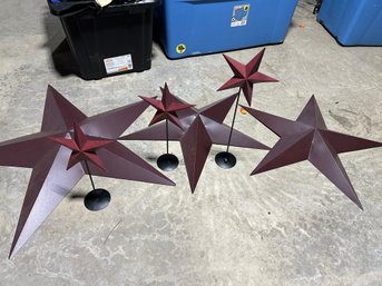 3 Burgandy Metal Stars With Three Small Table Stars On Bases