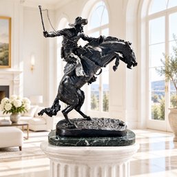 After Frederic Remington (American, 18611909), 'The Bronco Buster,' Bronze-Patinated Equestrian Sculpture,