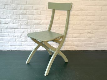 A Sage Green Folding Chair