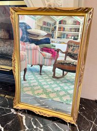 A Vintage Ornate Gold Tone Wall Mirror