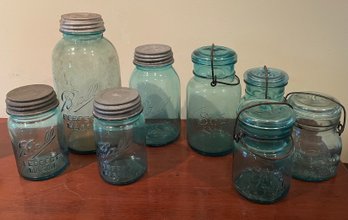 A Group Of 8 Early Blue Mason Jars And Others