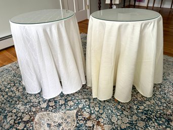 Pair Of Skirted Tables With Coordinating Fabric And Glass Tops