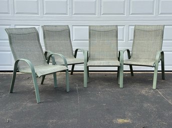 A Set Of Four Stackable Outdoor Sling Chairs In Green