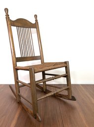 Childs Antique Spindleback And Rush Seat Rocking Chair