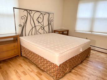 A Tall Metal Whimsical Headboard With Frame