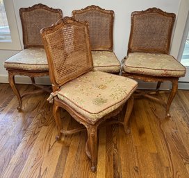 Four Carved And Caned Chairs