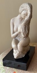 Nude Sculpture On Black Plinth