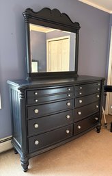 Newer Eight Drawer  Dresser With Mirror  In Black.
