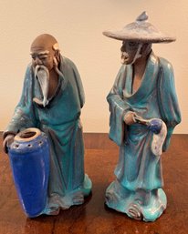 Pair Vintage Chinese Mudman Figurines .