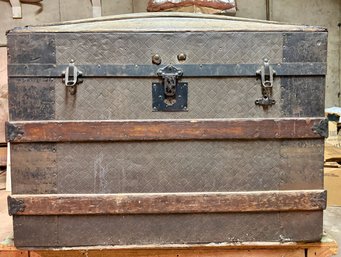 An Antique Dome Top Steamer Trunk.