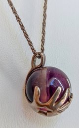 Silver Tone Hands Holding Polished Fluorite Sphere Necklace On Sterling Silver Chain